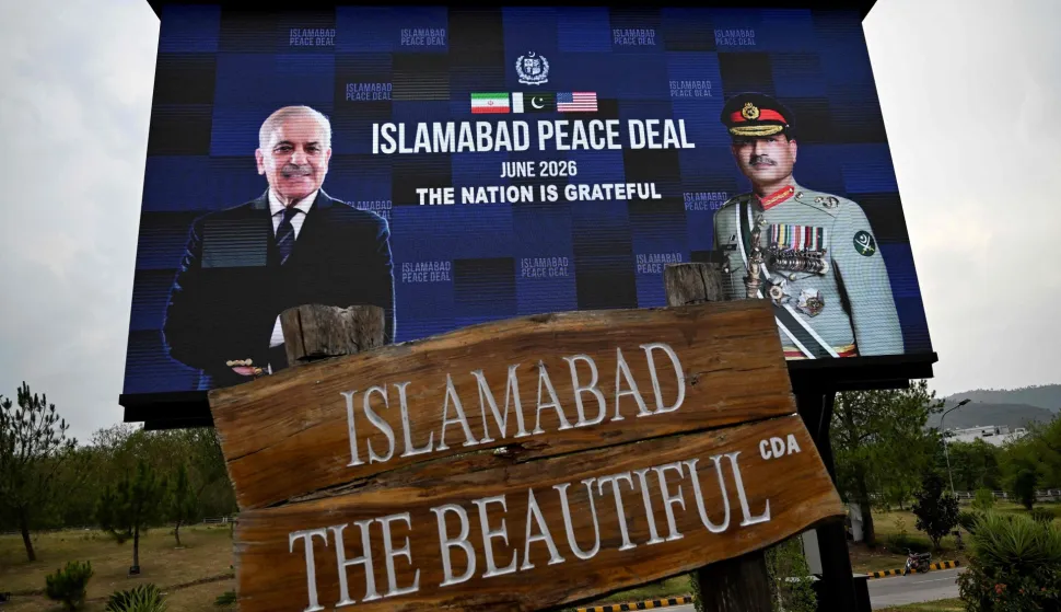 An electronic board featuring Pakistan's Prime Minister Shehbaz Sharif (L) alongside Army Chief and Field Marshal Syed Asim Munir is displayed along a roadside in Islamabad on June 17, 2026, after the US?Iran peace deal announcement. Top officials from the United States and Iran will meet at a luxury mountainside resort in Switzerland on June 19, to sign a deal -- which Pakistan has helped mediate -- to bring the Middle East war to an end. (Photo by Aamir QURESHI/AFP)
