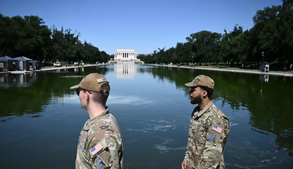 Soldiers walk near the Lincoln Memorial Reflecting Pool following the completion of recent renovations in Washington, DC, on June 16, 2026. The reflecting pool project, undertaken as part of President Donald Trump?s preparations for the nation?s 250th anniversary, began in April and was completed last week. (Photo by Brendan SMIALOWSKI/AFP)