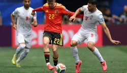 Belgium's forward #22 Alexis Saelemaekers and Iran's forward #09 Mehdi Taremi fight for the ball during the 2026 World Cup Group G football match between Belgium and Iran at the Los Angeles Stadium in Inglewood on June 21, 2026. (Photo by Patrick T. Fallon/AFP)