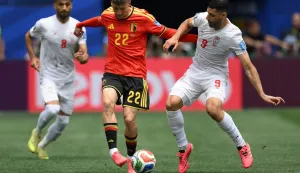 Belgium's forward #22 Alexis Saelemaekers and Iran's forward #09 Mehdi Taremi fight for the ball during the 2026 World Cup Group G football match between Belgium and Iran at the Los Angeles Stadium in Inglewood on June 21, 2026. (Photo by Patrick T. Fallon/AFP)