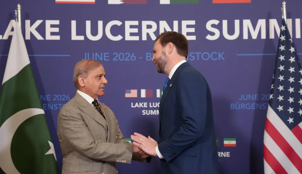 TOPSHOT - US Vice President JD Vance (R) shakes hands with Pakistan's Prime Minister Shehbaz Sharif at the Burgenstock luxury hotel complex overlooking Lake Lucerne, Switzerland, on June 21, 2026, ahead of high-level talks aimed at advancing a deal to end the Middle East conflict. A new round of negotiations over the Middle East war was set to kick off on June 21, 2026 with Iranian negotiators arriving in the Swiss host city hours ahead of US Vice President JD Vance, even as Tehran said it was closing the Strait of Hormuz again over Israeli attacks in Lebanon. (Photo by Nathan Howard/POOL/AFP)