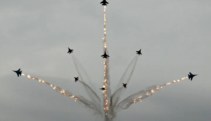 TOPSHOT - Russia's MiG-29 jet fighters of the Strizhi (Swifts) and Su-30SM jet fighters of the Russkiye Vityazi (Russian Knights) aerobatic teams perform during the International Maritime Defence Show "Fleet" 2026 in Kronstadt on June 10, 2026. (Photo by Olga MALTSEVA/AFP)