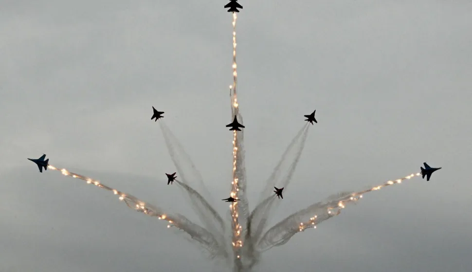 TOPSHOT - Russia's MiG-29 jet fighters of the Strizhi (Swifts) and Su-30SM jet fighters of the Russkiye Vityazi (Russian Knights) aerobatic teams perform during the International Maritime Defence Show "Fleet" 2026 in Kronstadt on June 10, 2026. (Photo by Olga MALTSEVA/AFP)