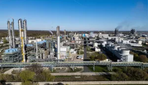 An aerial view shows the SKW Piesteritz agro-chemical plant in Piesteritz near Wittenberg, northern Germany, on April 9, 2026. As the effective closure of the Strait of Hormuz continues to roil the global economy, one German town has been scrambling to help make up the shortfall in essential supplies of fertilisers. Wittenberg, better known to many as a cradle of the Protestant Reformation, is also home to a chemical plant founded in 1915, in the midst of World War One. At SKW's sprawling 220-hectare site, a 23-kilometer rail transports urea, ammonia and finished fertilisers, destined for sites across Germany and also elsewhere in Europe. SKW is Germany's largest producer of urea, an essential component of fertilisers. The plant has been running at full capacity to try to make up the shortfall in supply from the Hormuz blockade. (Photo by John MACDOUGALL/AFP)