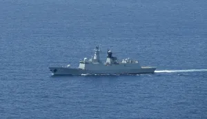 A ship identified by the Philippine Coast Guard as a Chinese Navy vessel is seen near Scarborough Shoal in the disputed South China Sea on June 15, 2026. (Photo by Jam STA ROSA/AFP)