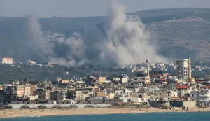 A photograph taken from the southern area of Tyre shows smoke rising from the sites of Israeli airstrikes on the village of Al-Qlaileh on June 10, 2026. Israeli strikes on southern Lebanon killed at least 12 people on June 10, a Lebanese medical source said, as Israel carried out strikes across the south including the coastal city of Sidon. (Photo by Kawnat HAJU/AFP)/