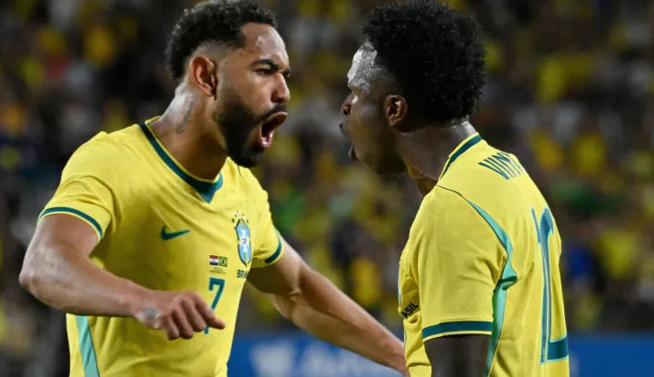 Brazil's forward #07 Matheus Cunha and Brazil's forward #10 Vinicius Junior celebrate their team's first goal during a friendly football match between Brazil and Croatia at Camping World Stadium in Orlando, Florida, on March 31, 2026. (Photo by MIGUEL J RODRIGUEZ CARRILLO/AFP)