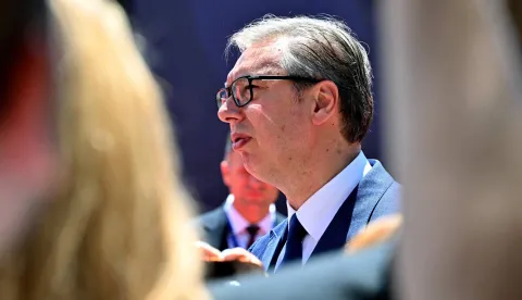 Serbia's President Aleksandar Vucic walks through a crowd of journalists as he arrives at an EU-Western Balkans Summit at Porto Montenegro in Tivat on June 5, 2026. (Photo by ELVIS BARUKCIC/AFP)