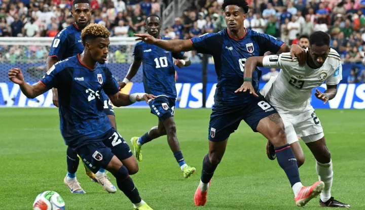 Cape Verde's defender #24 Wagner Pina (L) takes the ball as Cape Verde's defender #08 Joao Paulo is challenged by Saudi Arabia's midfielder #23 Mohamed Kanno during the 2026 World Cup Group H football match between Cape Verde and Saudi Arabia at the Houston Stadium in Houston on June 26, 2026. (Photo by RONALDO SCHEMIDT/AFP)