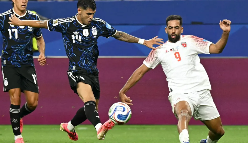 Argentina's midfielder #14 Exequiel Palacios and Jordan's forward #09 Ali Olwan fight for the ball during the 2026 World Cup Group J football match between Jordan and Argentina at the Dallas Stadium in Arlington on June 27, 2026. (Photo by Paul ELLIS/AFP)