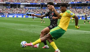 Canada's midfielder #17 Tajon Buchanan and South Africa's defender #21 Ime Okon (R) fight for the ball during the 2026 World Cup round of 32 football match between South Africa and Canada at the Los Angeles Stadium in Inglewood on June 28, 2026. (Photo by Patrick T. Fallon/AFP)
