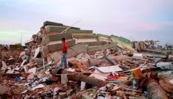 A man stands amid debris at the site of a collapsed building in the aftermath of earthquakes, in La Guaira, Venezuela, June 30, 2026. REUTERS/Ricardo Arduengo Photo: RICARDO ARDUENGO/REUTERS