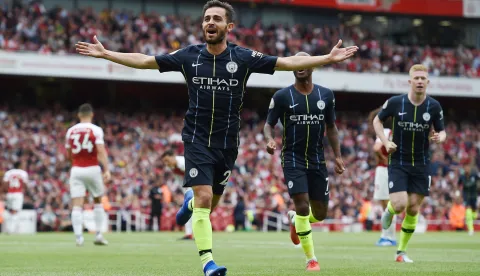 epa06946114 Manchester City's Bernardo Silva celebrates after scoring during the English Premier League soccer match between Arsenal FC and Manchester City at the Emirates Stadium in London, Britain, 12 August 2018. EPA/ANDY RAIN EDITORIAL USE ONLY. No use with unauthorized audio, video, data, fixture lists, club/league logos or 'live' services. Online in-match use limited to 75 images, no video emulation. No use in betting, games or single club/league/player publications.