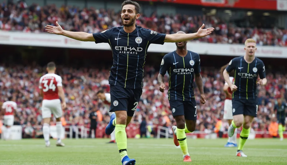 epa06946114 Manchester City's Bernardo Silva celebrates after scoring during the English Premier League soccer match between Arsenal FC and Manchester City at the Emirates Stadium in London, Britain, 12 August 2018. EPA/ANDY RAIN EDITORIAL USE ONLY. No use with unauthorized audio, video, data, fixture lists, club/league logos or 'live' services. Online in-match use limited to 75 images, no video emulation. No use in betting, games or single club/league/player publications.