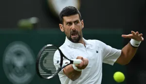 Serbia's Novak Djokovic returns the ball to Greece's Stefanos Tsitsipas during their men's singles second round tennis match on the third day of the 2026 Wimbledon Championships at The All England Lawn Tennis and Croquet Club in Wimbledon, southwest London, on July 1, 2026. (Photo by Kirill KUDRYAVTSEV/AFP)/RESTRICTED TO EDITORIAL USE