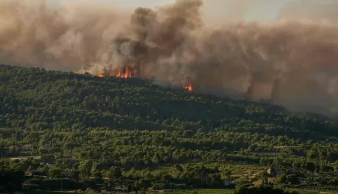 This photograph shows a wildfire in Pouzols-Minervois, southwestern of France, July 1, 2026. (Photo by Idriss Bigou-Gilles/AFP)