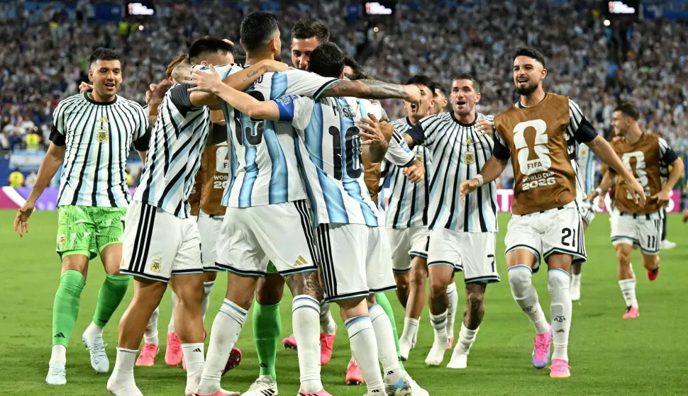 Argentina's defender #13 Cristian Romero celebrates with teammates scoring his team's third goal during the 2026 World Cup round of 32 football match between Argentina and Cape Verde at the Miami Stadium in Miami Gardens on July 3, 2026. (Photo by CHANDAN KHANNA/AFP)