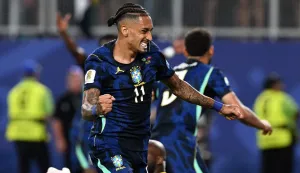 Brazil's forward #11 Raphinha celebrates his team's first goal scored by forward #09 Matheus Cunha (in the background) during the 2026 World Cup Group C football match between Brazil and Haiti at the Philadelphia Stadium in Philadelphia on June 19, 2026. (Photo by ROBERTO SCHMIDT/AFP)