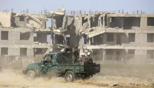 epa11104214 Houthi troopers aboard a pick-up truck driving past a previous bombing-destroyed building on the outskirts of Sana'a, Yemen, 25 January 2024. The United States and United Kingdom have announced joint sanctions against four key military figures within the Houthi group amid the escalation in the Houthis' attacks on commercial shipping in the Red Sea and the Gulf of Aden. The leader of Yemen's Houthis, Abdul-Malik al-Houthi, said that his group has fired more than 200 drones and 50 missiles at 'Israeli-linked' ships in the Red Sea since last November, when the Houthis began attacks against Israel and commercial shipping in retaliation for the Israeli bombardment of the Gaza Strip. The US Department of State on 17 January announced the designation of Yemen's Houthis as a 'Specially Designated Global Terrorist group' amid an escalation of their attacks on shipping lanes in the Red Sea, the Bab al-Mandab Strait, and the Gulf of Aden since November 2023. The US Department of Defense announced in December 2023 a multinational operation to safeguard trade and protect ships in the Red Sea. EPA/YAHYA ARHAB