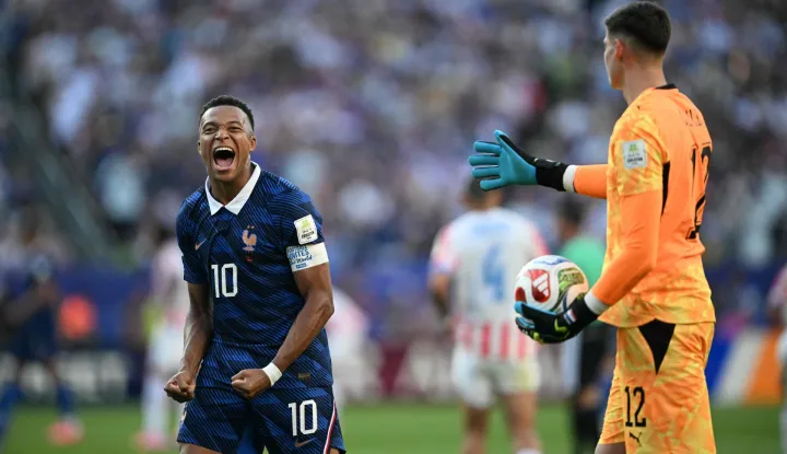 France's forward #10 Kylian Mbappe celebrates past Paraguay's goalkeeper #12 Orlando Gill after winning the 2026 World Cup round of 16 football match between Paraguay and France at the Philadelphia Stadium in Philadelphia on July 4, 2026. (Photo by MAURO PIMENTEL/AFP)