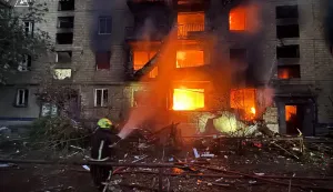 This handout photograph taken and released by the Ukrainian Emergency Service on July 2, 2026 shows rescuers extinguishing a fire in a residential building damaged following missile strikes on the Ukrainian capital of Kyiv, amid the Russian invasion in Ukraine. Russian missile and drone strikes rocked Kyiv early on July 2, setting off fires and wounding at least five people, after President Volodymyr Zelensky warned that Moscow was preparing a "massive attack". (Photo by Handout/UKRAINIAN EMERGENCY SERVICE/AFP)