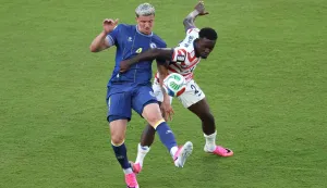 SANTA CLARA, CALIFORNIA - JULY 01: Folarin Balogun #20 of the United States fouls Tarik Muharemovic #4 of Bosnia and Herzegovina which is later reviewed by VAR and awarded as a red card foul a during the FIFA World Cup 2026 Round of 32 match between USA and Bosnia and Herzegovina at San Francisco Bay Area Stadium on July 01, 2026 in Santa Clara, California. Michael Steele/Getty Images/AFP (Photo by MICHAEL STEELE/GETTY IMAGES NORTH AMERICA/Getty Images via AFP)