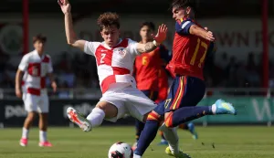 DENBIGH, WALES - JULY 08: Jose Antonio Morante Antunez of Spain is challenged by Noa Mikic of Croatia during the UEFA European Under-19 Championship 2026 semi-final match between Spain and Croatia at Central Park on July 08, 2026 in Denbigh, Wales. (Photo by Harry Murphy - UEFA/UEFA via Getty Images)