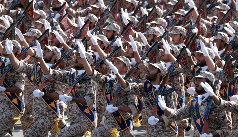 epa07038748 Iranian soldiers march during the annual military parade marking the Iraqi invasion in 1980, which led to an eight-year-long war (1980-1988), in Tehran, Iran, 22 September 2018. Rouhani commented on the war with Iraqi and to the current tensions between Iran and the USA after US President Donald J. Trump withdrew last May from a landmark multilateral nuclear deal. On the same day, gunmen have reportedly opened fire killing at least 24 people, including civilians, and injuring dozens during an Iranian military parade in the south-western city of Ahvaz, media reported. EPA/ABEDIN TAHERKENAREH