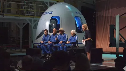 epa09355354 A frame grab from a Blue Origin handout video showing (L-R) Oliver Daemen, Mark Bezos, Jeff Bezos, Wally Funk and Ariane Cornell during a press conference after Blue Origin New Shepard made a trip to space following lift off from Launch Site One, Texas, USA, 20 July 2021. EPA/BLUE ORIGIN/HANDOUT HANDOUT EDITORIAL USE ONLY/NO SALES