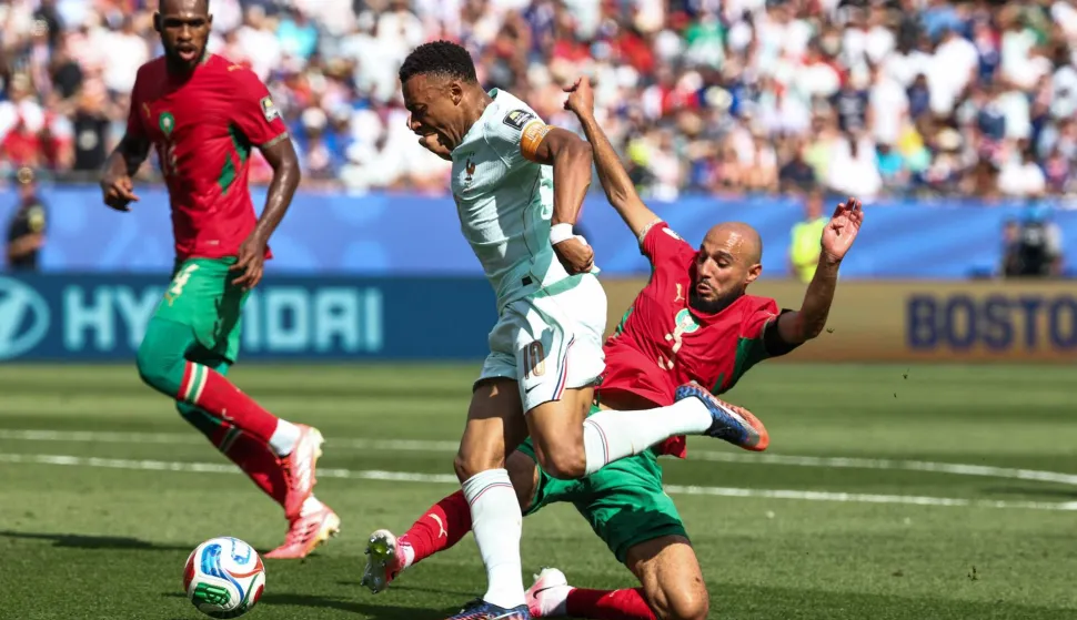 France's forward #10 Kylian Mbappe is fouled by Morocco's defender #03 Noussair Mazraoui to concede a penalty during the 2026 World Cup football tournament quarter-final match between France and Morocco at Boston Stadium in Foxborough on July 9, 2026. (Photo by FRANCK FIFE/AFP)