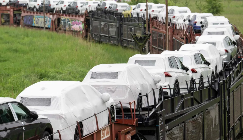 (FILES) Cars of the Volkswagen (VW) group are transported by rail on the compound at production site of the German carmaker in Emden, northern Germany, on May 20, 2022. Europe's largest carmaker Volkswagen is considering cutting tens of thousands more jobs worldwide and shuttering up to four plants in Germany, Manager Magazin reported on June 2026. Volkswagen is already planning to cut 50,000 jobs across its brands in Germany by 2030 as it is struggling with high costs, US tariffs and fierce Chinese competition in electric vehicles. Volkswagen would also close plants at Hanover, Zwickau and Emden after production runs of models currently made there end. (Photo by DAVID HECKER/AFP)