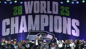 SEATTLE, WASHINGTON - FEBRUARY 11: Leonard Williams #99 of the Seattle Seahawks raises the Lombardi Trophy during the Seattle Seahawks Super Bowl LX victory celebration and parade at Lumen Field on February 11, 2026 in Seattle, Washington. Steph Chambers/Getty Images/AFP (Photo by Steph Chambers/GETTY IMAGES NORTH AMERICA/Getty Images via AFP)