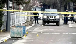 epa06443278 Police guards at the sealed-off crime scene where Oliver Ivanovic, the former State Secretary for Kosovo and Metohija and a subject of a controversial war crimes trial and retrial, was shot in Mitrovica, Serbia, 16 January 2018. The prominent Ivanovic was shot in front of his office in Mitrovica, Kosovo, 16 January 2018, according to media reports. EPA/STRINGER