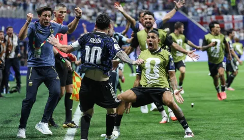 Argentina's forward #10 Lionel Messi celebrates with teammate defender #25 Facundo Medina his team's second goal scored by Argentina's forward #22 Lautaro Martinez (out of frame) during the 2026 World Cup football tournament semi-final match between England and Argentina at the Atlanta Stadium in Atlanta on July 15, 2026. (Photo by Thomas COEX/AFP)