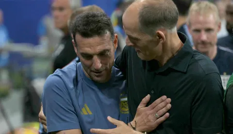 England's German head coach Thomas Tuchel (R) and Argentina's head coach Lionel Scaloni (L) embrace ahead of the 2026 World Cup football tournament semi-final match between England and Argentina at the Atlanta Stadium in Atlanta on July 15, 2026. (Photo by JUAN MABROMATA/AFP)