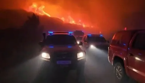 This screen grab taken from handout video footage released on July 17, 2026 by Spain's Military Emergencies Unit (UME) shows vehicles taking part in the military unit fighting a massive wildfire through the night in a sparsely populated part of the Aragon region in the country's northeast, after the blaze doubled in size overnight to scorch over 12,000 hectares. (Photo by Handout/UME/AFP)/RESTRICTED TO EDITORIAL USE - MANDATORY CREDIT "AFP PHOTO/SPAIN'S MILITARY EMERGENCIES UNIT (UME)/HANDOUT/" - NO MARKETING NO ADVERTISING CAMPAIGNS - DISTRIBUTED AS A SERVICE TO CLIENTS