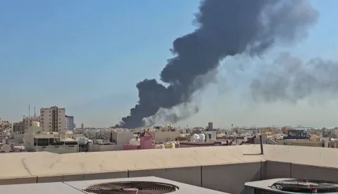 This screen grab taken from UGC video footage posted on social media on July 18, 2026, shows a plume of black smoke billowing over the town of Mangaf, south of Kuwait City. Kuwait accused Iran on July 18 of targeting civilian sites and vital infrastructure in the country, after reporting attacks on an oil facility and a power and water plant. (Photo by various sources/AFP)/RESTRICTED TO EDITORIAL USE - MANDATORY CREDIT AFP - SOURCE: UGC/UNKNOWN - DISTRIBUTED AS A SERVICE TO CLIENTS - NO ARCHIVE - NO RESALE - NO USE AFTER: JULY 27, 2026 15:00:00 GMT
