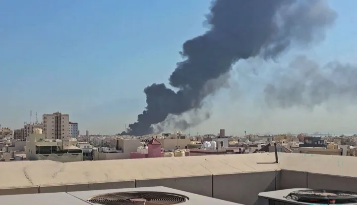 This screen grab taken from UGC video footage posted on social media on July 18, 2026, shows a plume of black smoke billowing over the town of Mangaf, south of Kuwait City. Kuwait accused Iran on July 18 of targeting civilian sites and vital infrastructure in the country, after reporting attacks on an oil facility and a power and water plant. (Photo by various sources/AFP)/RESTRICTED TO EDITORIAL USE - MANDATORY CREDIT AFP - SOURCE: UGC/UNKNOWN - DISTRIBUTED AS A SERVICE TO CLIENTS - NO ARCHIVE - NO RESALE - NO USE AFTER: JULY 27, 2026 15:00:00 GMT