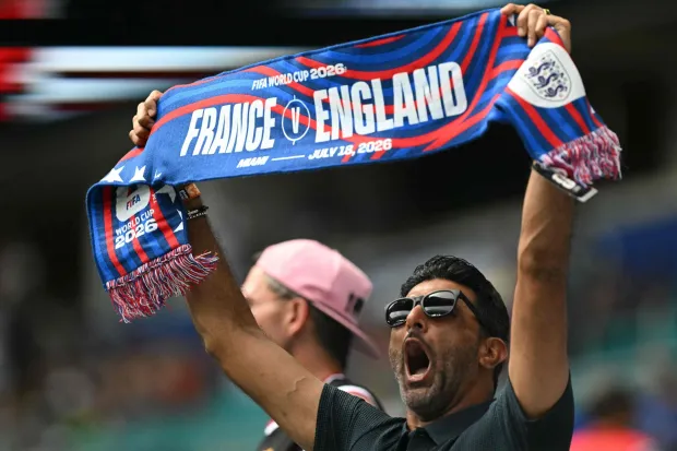 A football fan shows a scarf ahead of the 2026 World Cup football tournament third-place match between France and England at the Miami Stadium in Miami on July 18, 2026. (Photo by ROBERTO SCHMIDT/AFP)