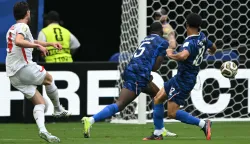 England's midfielder #04 Declan Rice scores his team's first goal during the 2026 World Cup football tournament third-place match between France and England at the Miami Stadium in Miami on July 18, 2026. (Photo by ROBERTO SCHMIDT/AFP)