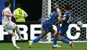 England's midfielder #04 Declan Rice scores his team's first goal during the 2026 World Cup football tournament third-place match between France and England at the Miami Stadium in Miami on July 18, 2026. (Photo by ROBERTO SCHMIDT/AFP)