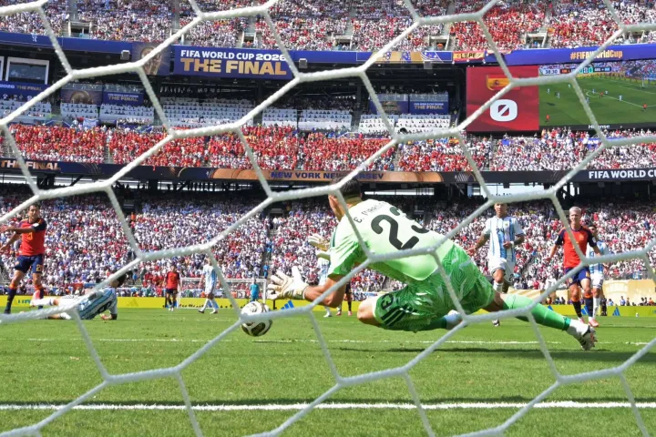 Argentina's goalkeeper #23 Emiliano Martinez stops the ball during the 2026 World Cup football tournament final match between Spain and Argentina at the New York/New Jersey Stadium in East Rutherford on July 19, 2026. (Photo by JUAN MABROMATA/AFP)