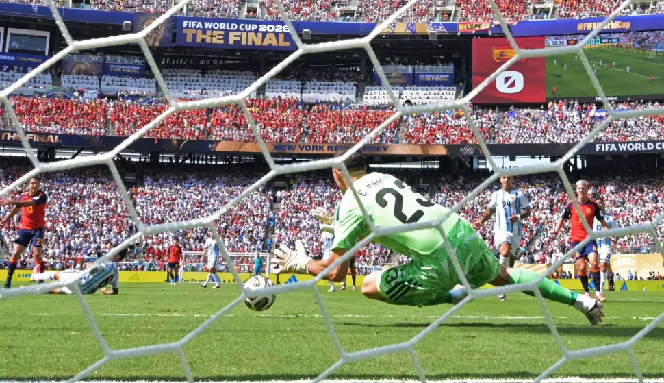 Argentina's goalkeeper #23 Emiliano Martinez stops the ball during the 2026 World Cup football tournament final match between Spain and Argentina at the New York/New Jersey Stadium in East Rutherford on July 19, 2026. (Photo by JUAN MABROMATA/AFP)