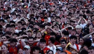 Spain supporters react while watching the 2026 FIFA World Cup quarterfinal match between Spain and Belgium on a giant screen in Madrid on July 10, 2026. (Photo by Oscar DEL POZO/AFP)