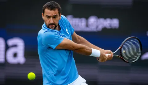 Croatia's Marin Cilic plays a backhand return to Russia's Daniil Medvedev during their mens singles match at the Libema Open tennis tournament in Rosmalen, on June 12, 2026. (Photo by Iris van den Broek/ANP/AFP)/Netherlands OUT