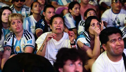 Argentina's fans react as they watch the FIFA World Cup final match between Spain and Argentina at Copacabana beach in Rio de Janeiro, Brazil, on July 19, 2026. (Photo by Pablo PORCIUNCULA/AFP)