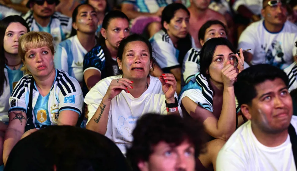 Argentina's fans react as they watch the FIFA World Cup final match between Spain and Argentina at Copacabana beach in Rio de Janeiro, Brazil, on July 19, 2026. (Photo by Pablo PORCIUNCULA/AFP)