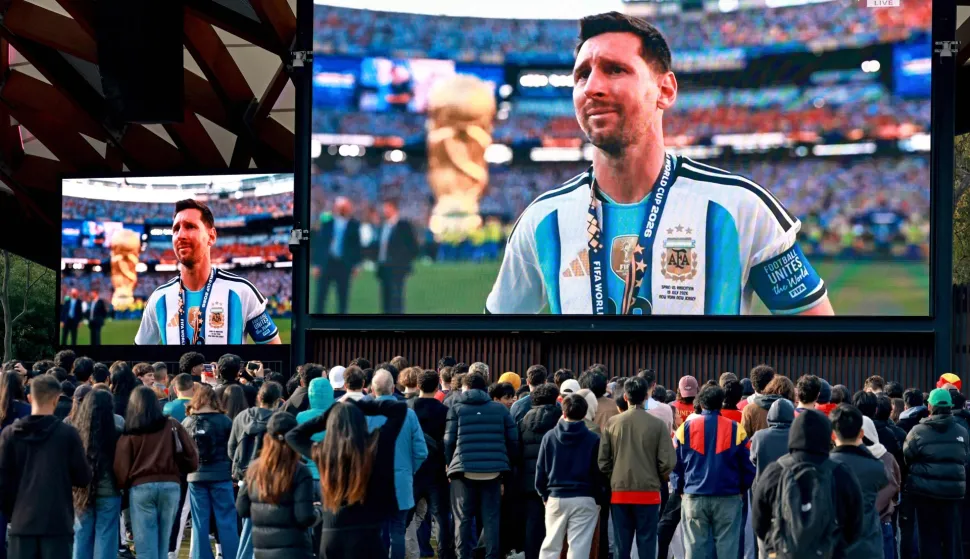Supporters watch Argentina's Lionel Messi reacting on giant screens in Sydney on July 20, 2026 after Spain defeated Argentina in the 2026 World Cup football final. (Photo by DAVID GRAY/AFP)/-- IMAGE RESTRICTED TO EDITORIAL USE - STRICTLY NO COMMERCIAL USE --