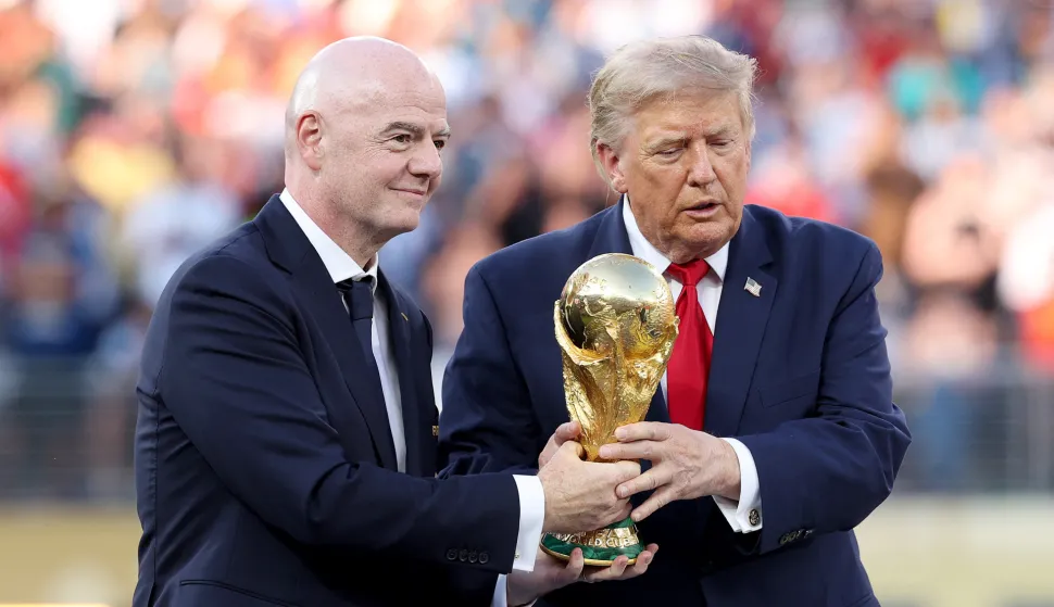 EAST RUTHERFORD, NEW JERSEY - JULY 19: U.S. President Donald Trump and FIFA President Gianni Infantino hold the FIFA World Cup Winner's Trophy before handing over to captain Rodri #16 of Spain at the award ceremony following the FIFA World Cup 2026 Final match between Spain and Argentina at New York New Jersey Stadium on July 19, 2026 in East Rutherford, New Jersey. Carl Recine/Getty Images/AFP (Photo by Carl Recine/GETTY IMAGES NORTH AMERICA/Getty Images via AFP)