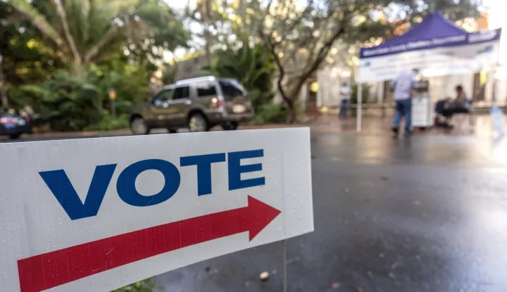 epa11673313 A sign points to a secure ballot intake station on Florida's first early voting day for the 2024 US presidential election at the Coral Gables regional library in Miami, Florida, USA, 21 October 2024. Voters in Florida can cast their ballots in person for the presidential election, starting on 21 October, avoiding long lines on Election Day on 05 November 2024. EPA/CRISTOBAL HERRERA-ULASHKEVICH